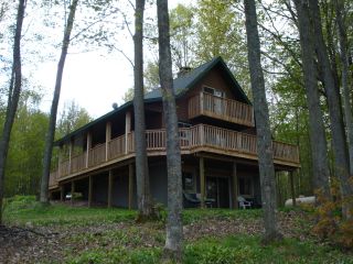 Golf Cabin is located on the 14th fairway on Wildneress Valley Golf Course at Black Forest.